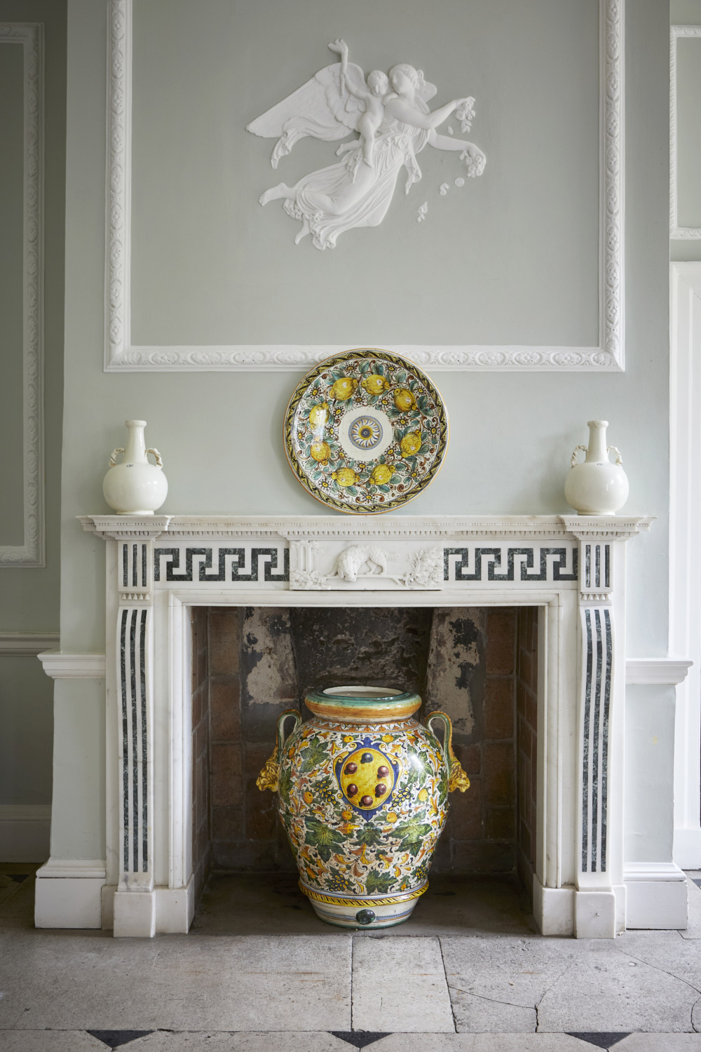 georgian fireplace adorned with maiolica ceramics